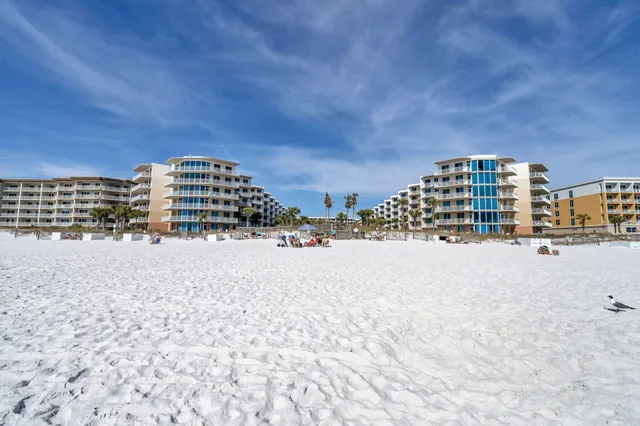 a view of a fountain is middle in the tall building
