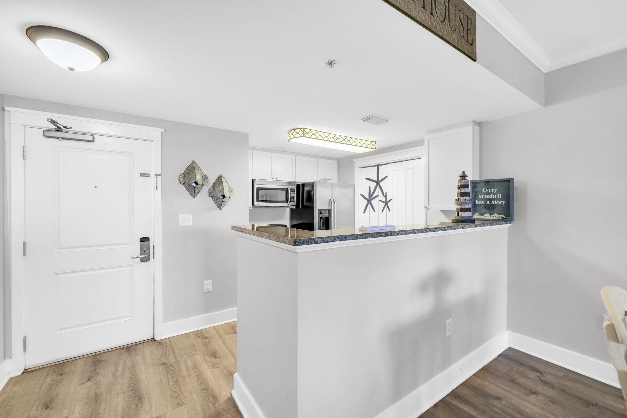 1110 Santa Rosa Boulevard, Unit A231 Fort Walton Beach, FL 32548 - Photo 8 of 59 a kitchen with stainless steel appliances a refrigerator and microwave