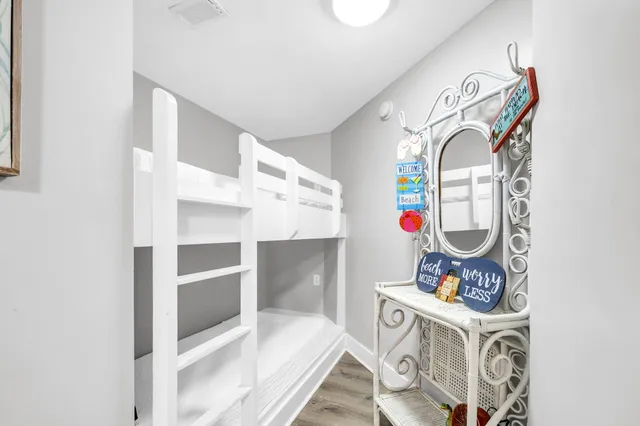 a view of a dining room with furniture wooden floor and chandelier
