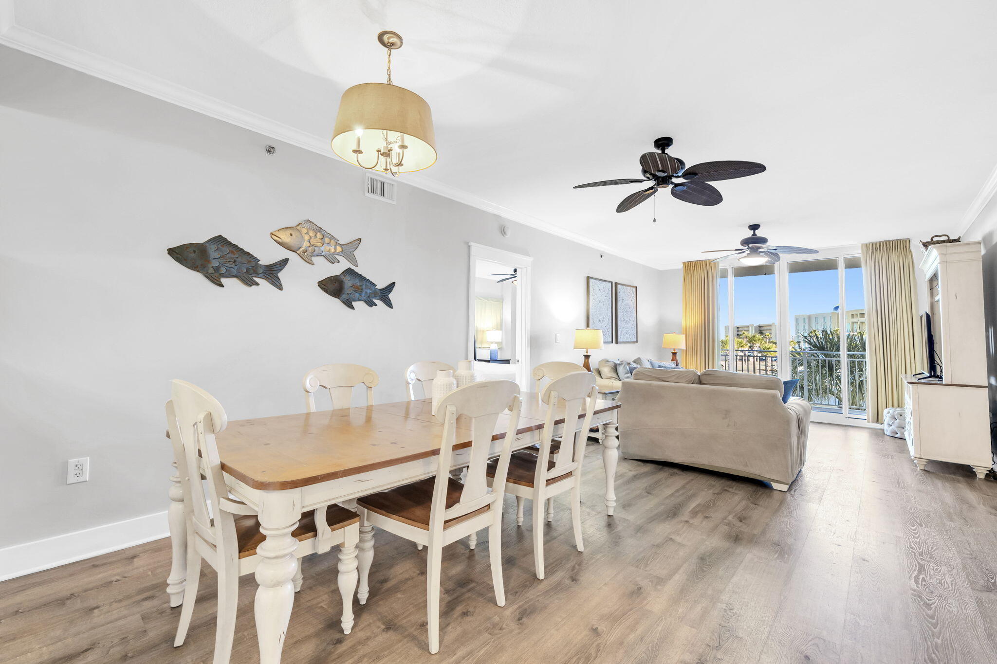 1110 Santa Rosa Boulevard, Unit A231 Fort Walton Beach, FL 32548 - Photo 10 of 59 a view of a dining room with furniture wooden floor and chandelier