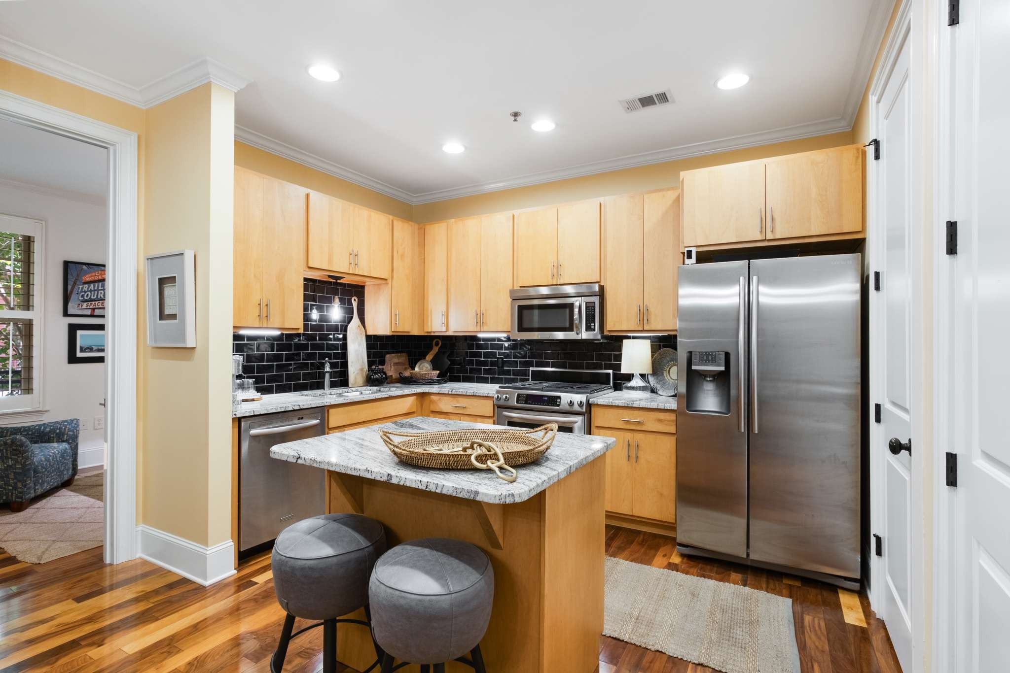 4401 Ridgefield Way Nashville, TN 37205 - Photo 15 of 46 a kitchen with stainless steel appliances granite countertop a refrigerator a stove and a sink with wooden floor