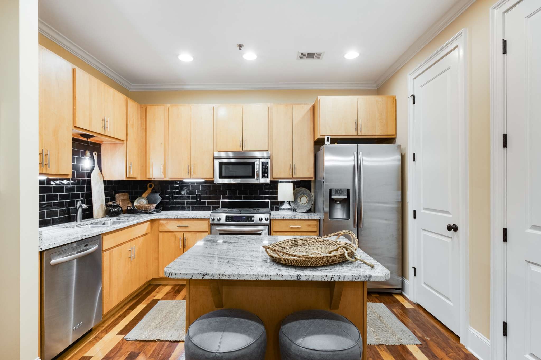 4401 Ridgefield Way Nashville, TN 37205 - Photo 16 of 46 a kitchen with stainless steel appliances granite countertop a refrigerator a stove and a sink with wooden floor