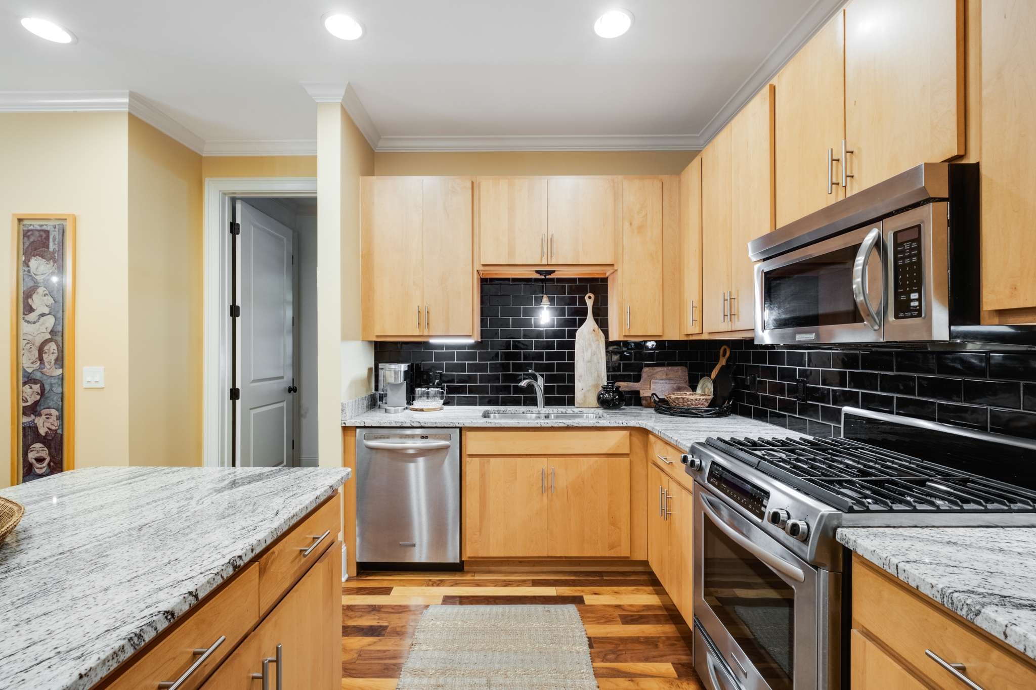 4401 Ridgefield Way Nashville, TN 37205 - Photo 17 of 46 a kitchen with stainless steel appliances granite countertop a stove top oven a sink dishwasher a refrigerator and a microwave