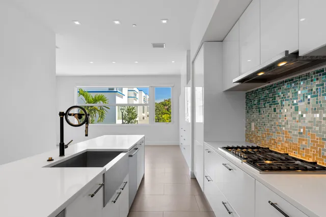 a kitchen that has a lot of cabinets in it