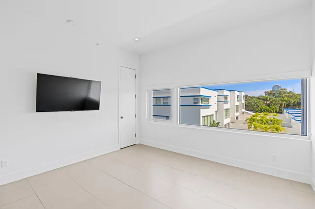 a view of a living room with a flat screen tv