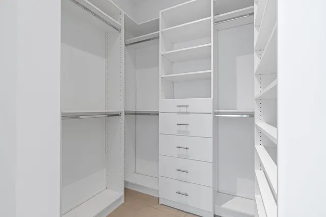 a view of an empty walk in closet