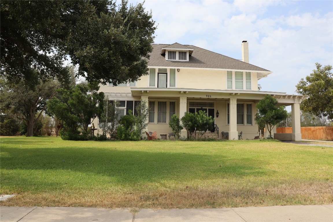 701 Sloan Street Taylor, TX 76574 - Photo 2 of 32 a front view of a house with a yard
