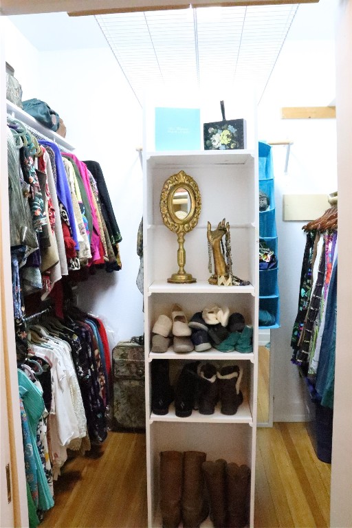 701 Sloan Street Taylor, TX 76574 - Photo 24 of 32 a view of walk in closet with clothes and shoes