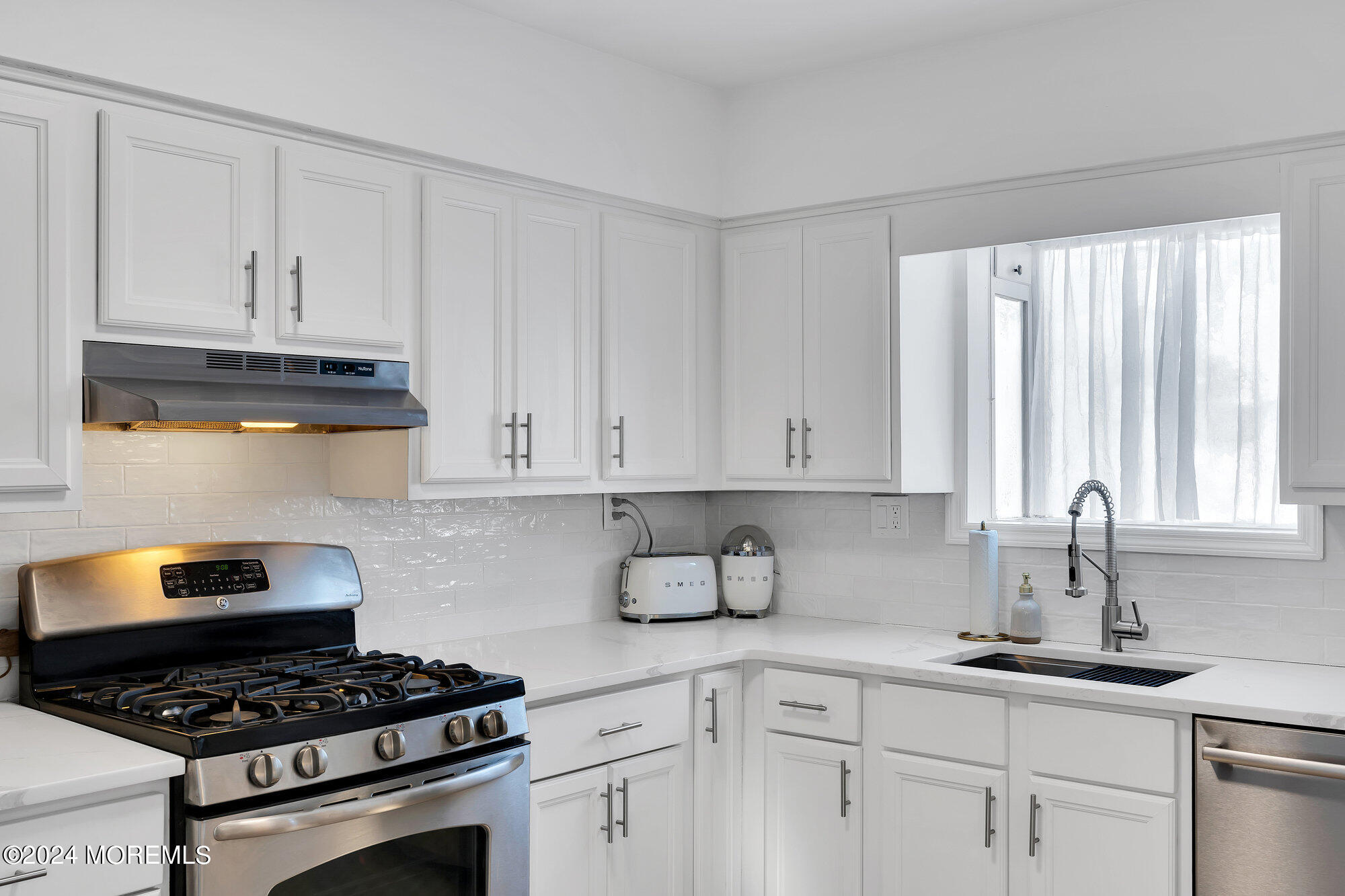 22 Devon Court Spring Lake Heights, NJ 07762 - Photo 12 of 54 a kitchen with granite countertop white cabinets and white appliances