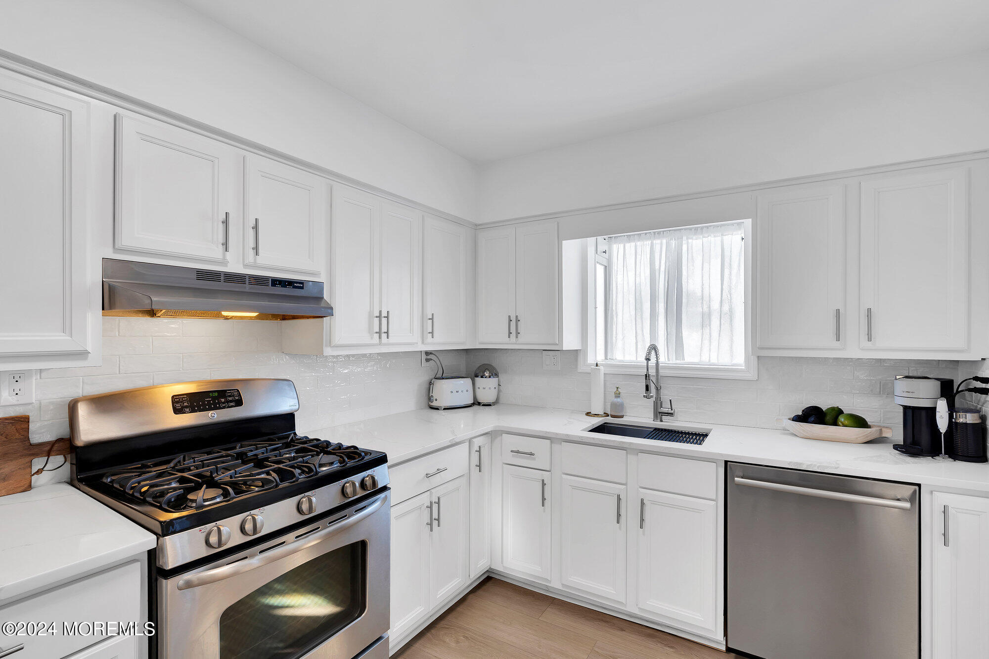 22 Devon Court Spring Lake Heights, NJ 07762 - Photo 13 of 54 a kitchen with granite countertop white cabinets and appliances