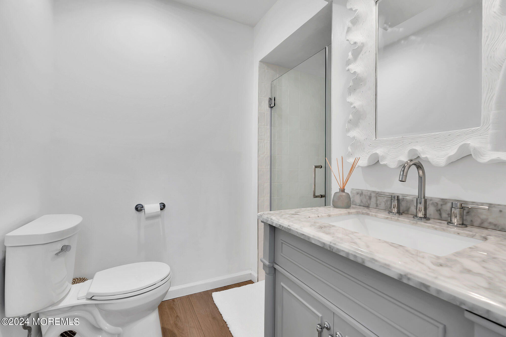 22 Devon Court Spring Lake Heights, NJ 07762 - Photo 25 of 54 a bathroom with a granite countertop sink a toilet and a mirror