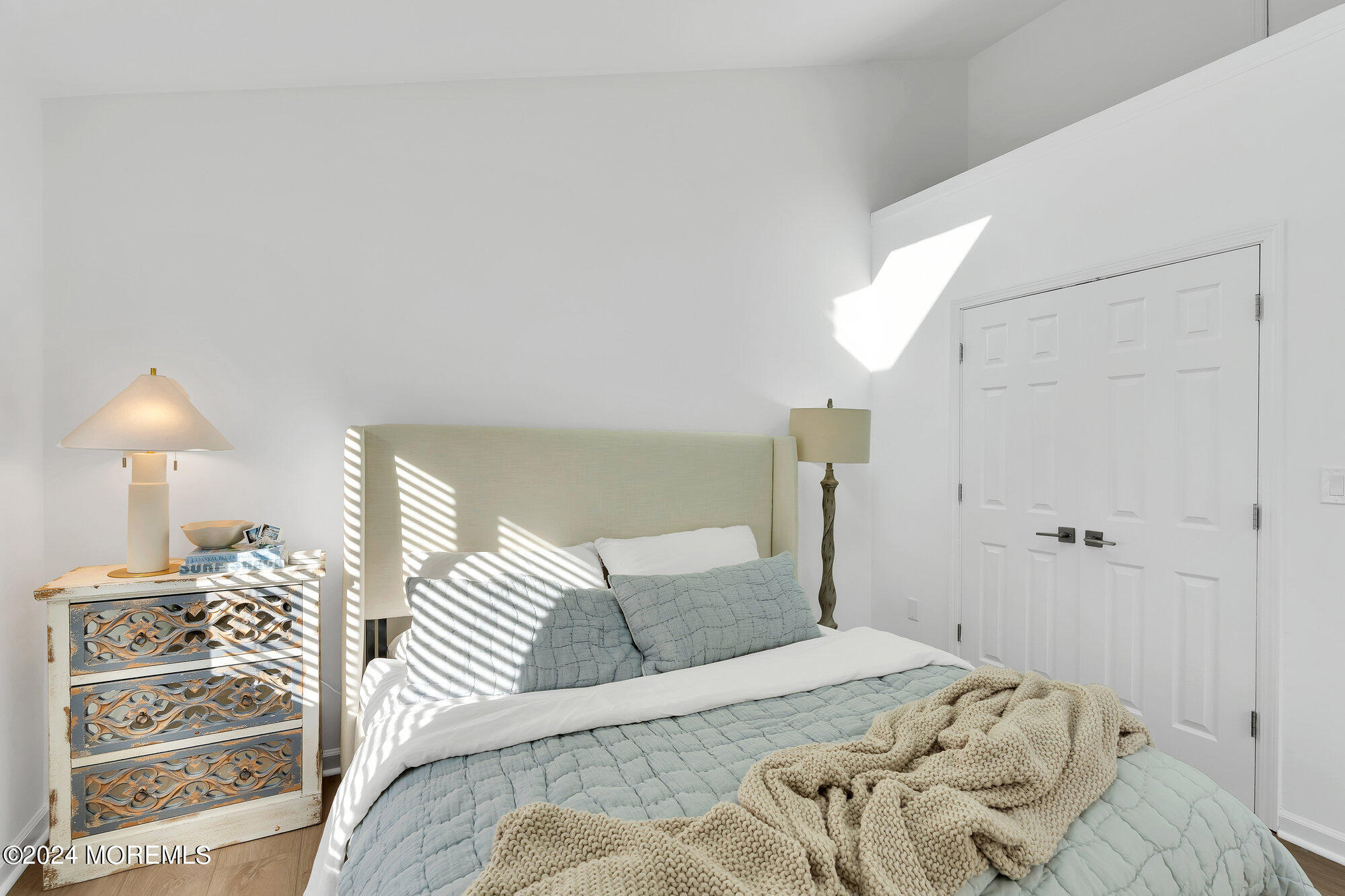 22 Devon Court Spring Lake Heights, NJ 07762 - Photo 39 of 54 a bedroom with a bed and a lamp