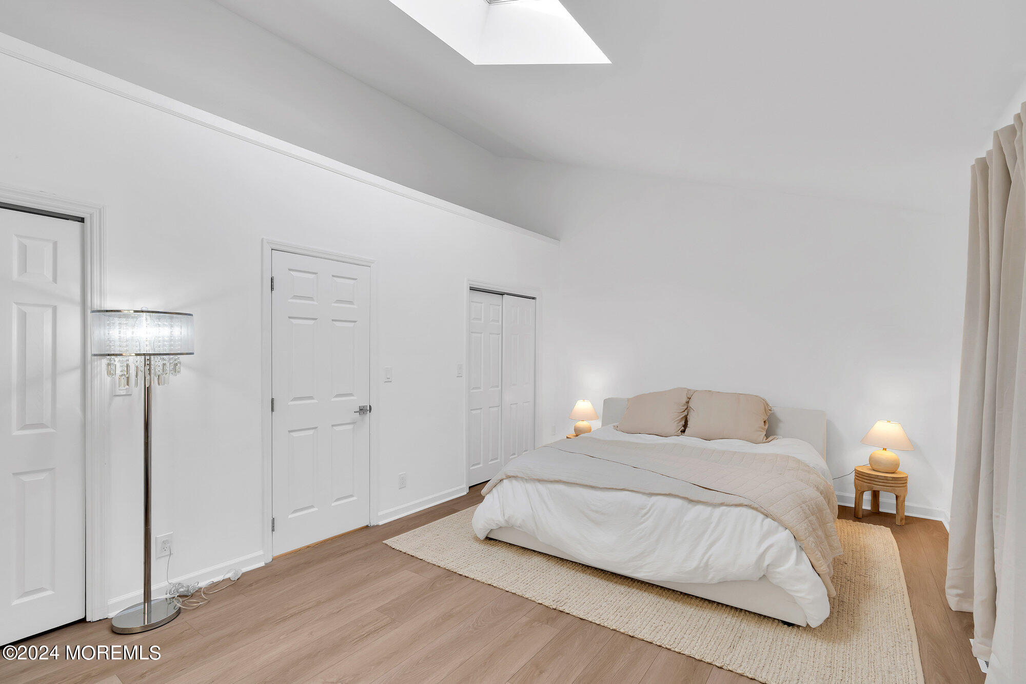 22 Devon Court Spring Lake Heights, NJ 07762 - Photo 45 of 54 a bedroom with a bed and a lamp