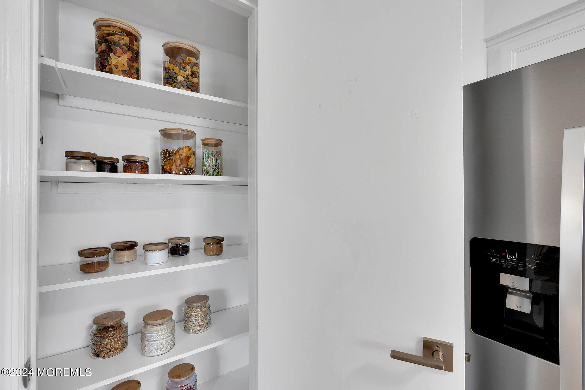 22 Devon Court Spring Lake Heights, NJ 07762 - Photo 50 of 54 a shelf with books and knick knacks on it