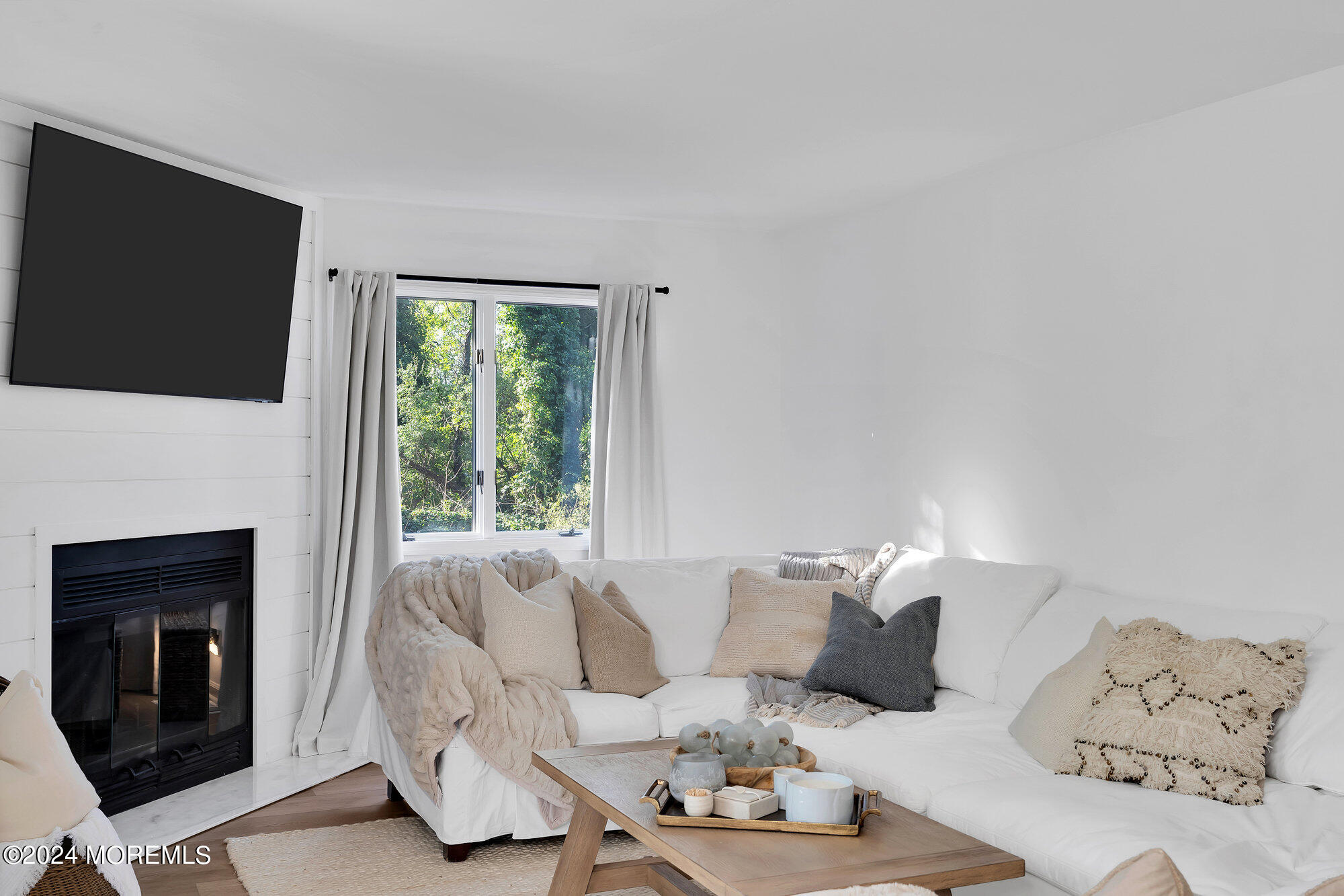 22 Devon Court Spring Lake Heights, NJ 07762 - Photo 52 of 54 a living room with furniture fireplace and flat screen tv
