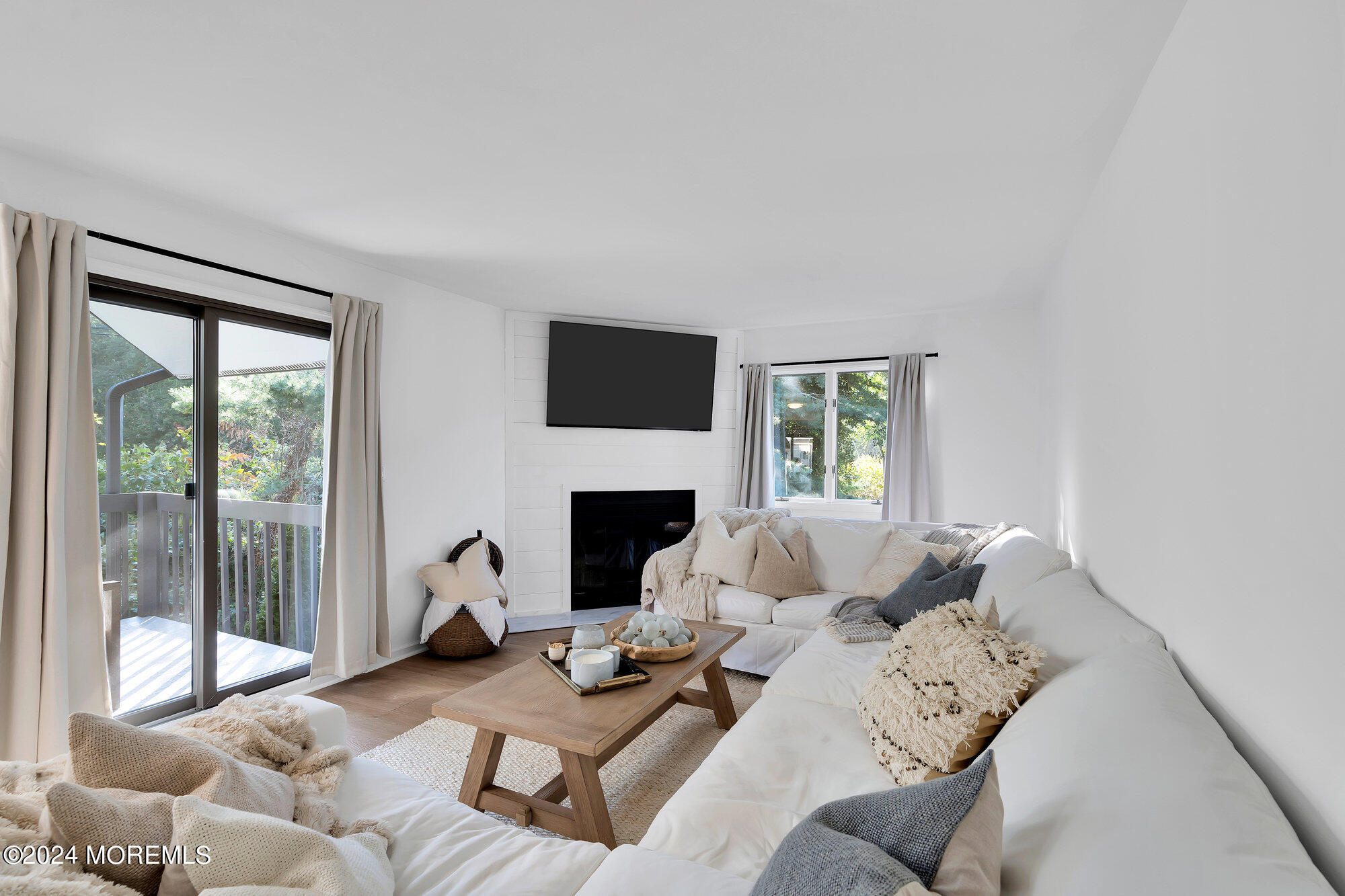 22 Devon Court Spring Lake Heights, NJ 07762 - Photo 54 of 54 a living room with furniture and a fireplace