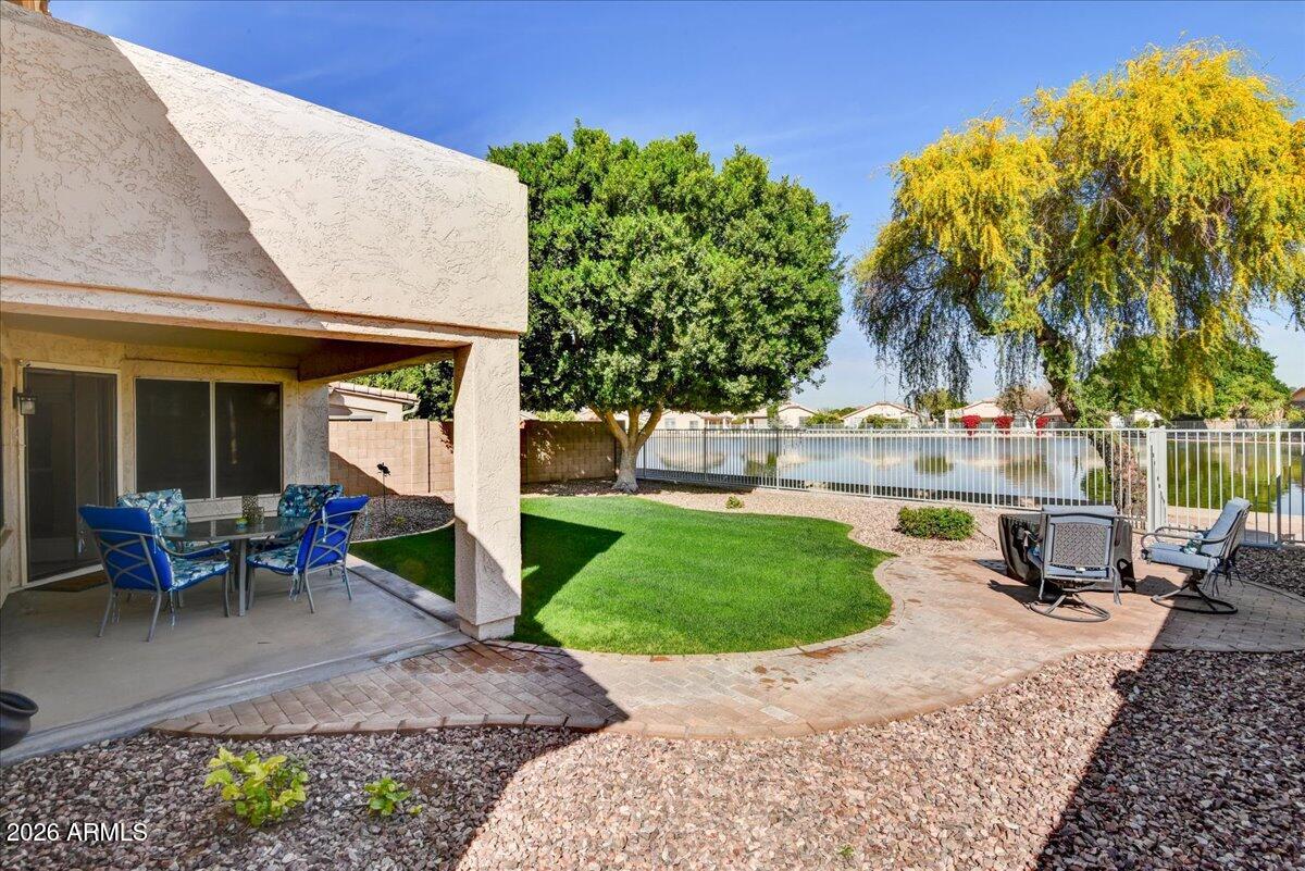 10830 West Almeria Road Avondale, AZ 85392 - Photo 21 of 27 a view of a backyard with sitting area
