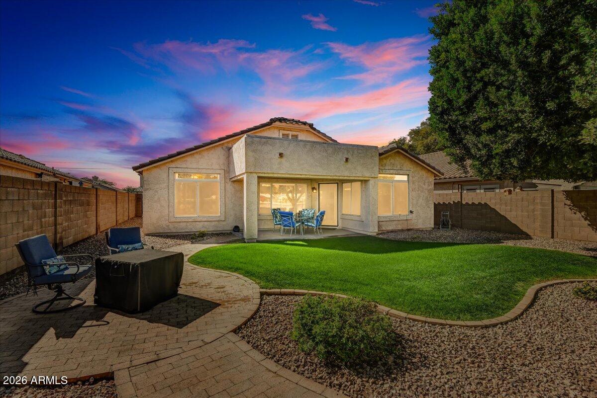 10830 West Almeria Road Avondale, AZ 85392 - Photo 23 of 27 a view of a house with backyard porch and garden