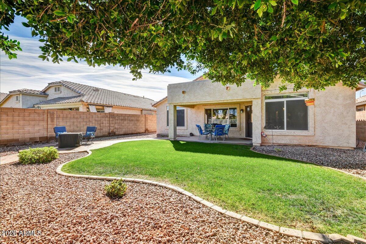 10830 West Almeria Road Avondale, AZ 85392 - Photo 24 of 27 a view of a porch with a garden
