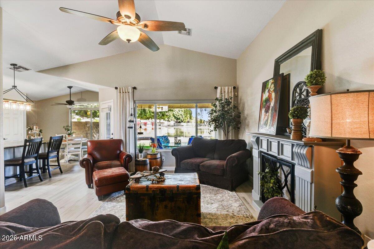 10830 West Almeria Road Avondale, AZ 85392 - Photo 26 of 27 a living room with furniture ceiling fan and a window