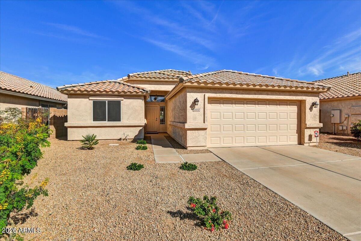10830 West Almeria Road Avondale, AZ 85392 - Photo 27 of 27 a front view of a house with a yard