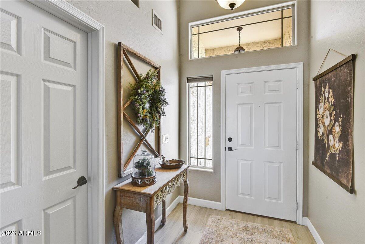 10830 West Almeria Road Avondale, AZ 85392 - Photo 3 of 27 a view of a livingroom with a flat screen tv