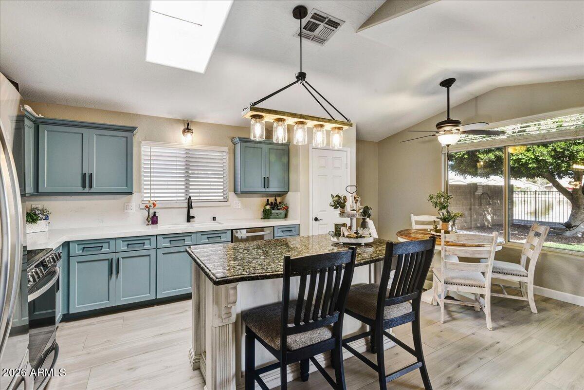 10830 West Almeria Road Avondale, AZ 85392 - Photo 7 of 27 a view of a dining room and chairs in a room
