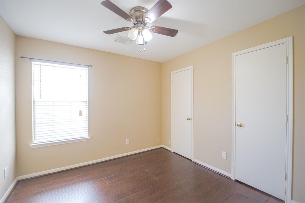 9611 Prairie Dog Run Sugar Land, TX 77498 - Photo 9 of 12 a view of an empty room with a window