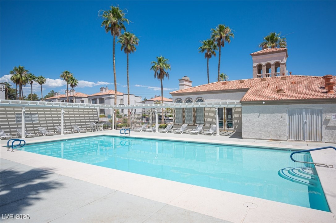 3150 North Soft Breezes Drive, Unit 2220 Las Vegas, NV 89128 - Photo 31 of 32 Community pool featuring a patio area
