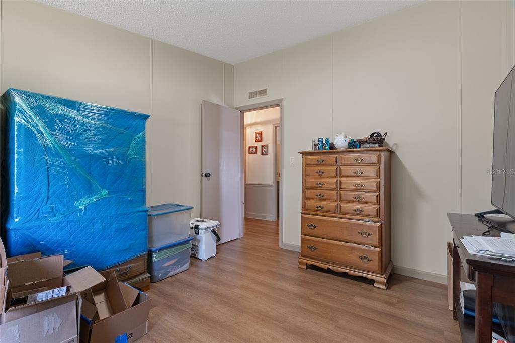 26255 Lambeth Road Brooksville, FL 34601 - Photo 35 of 76 a view of room with furniture and wooden floor