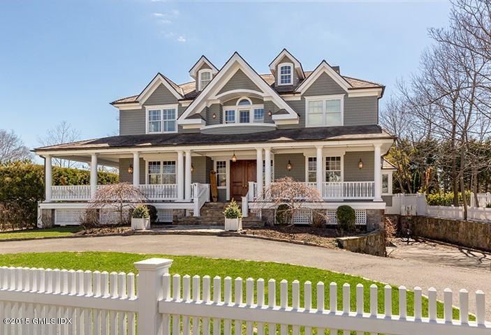 14 Rocky Point Road Old Greenwich, CT 06870 - Photo 1 of 23 a front view of a house with a yard