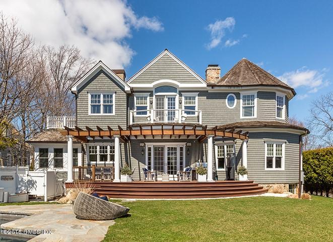 14 Rocky Point Road Old Greenwich, CT 06870 - Photo 3 of 23 a front view of a house with a yard