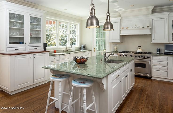 14 Rocky Point Road Old Greenwich, CT 06870 - Photo 8 of 23 a kitchen with granite countertop a sink a counter space appliances and cabinets