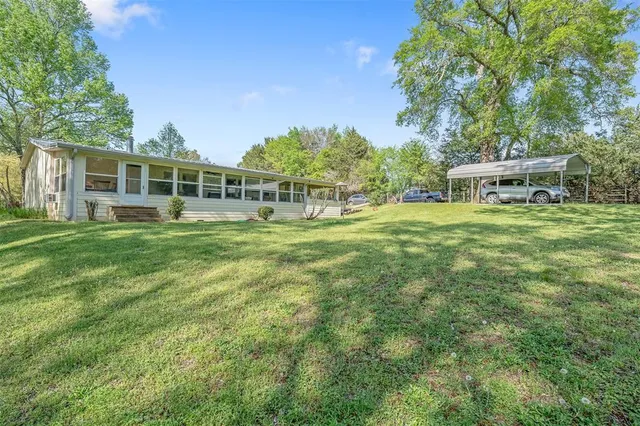 a living room with furniture and windows