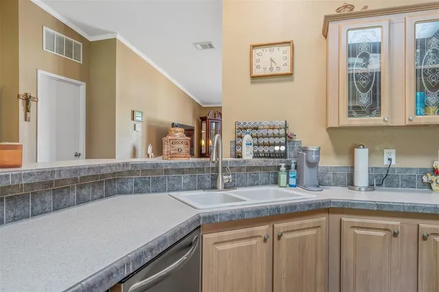 a view of a lake with houses in the background