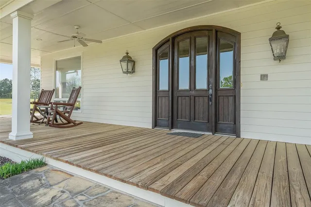a view of a livingroom with wooden floor and furniture