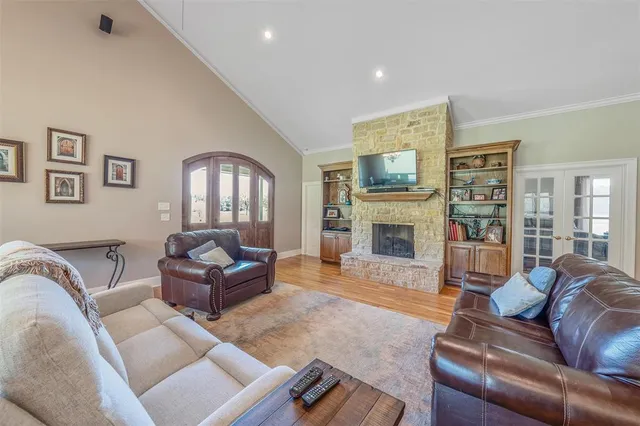 a living room with furniture fireplace and a window