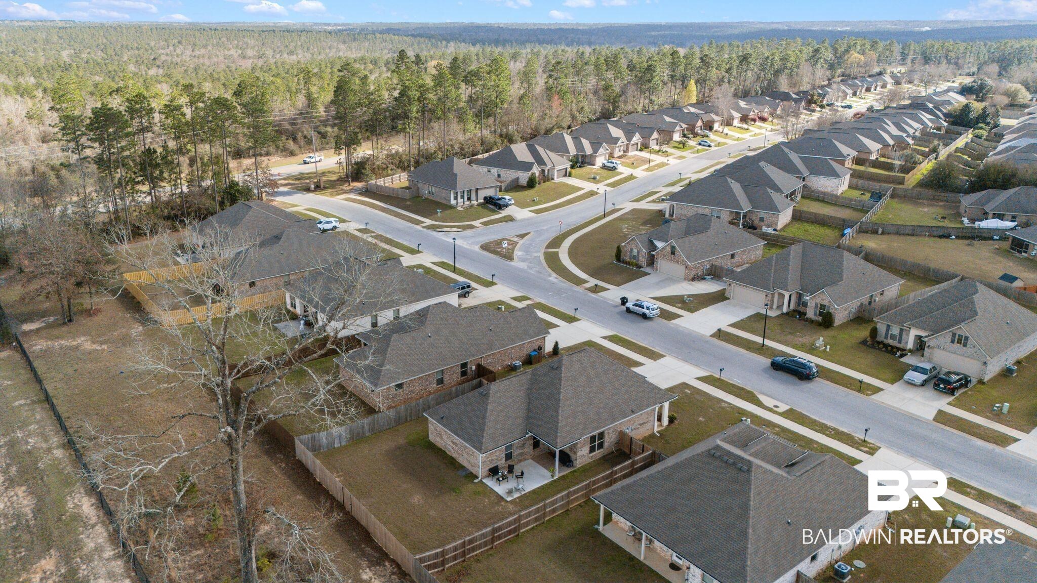 10745 Brodick Loop Daphne, AL 36527 - Photo 34 of 39 Aerial view of residential area featuring a heavily wooded area