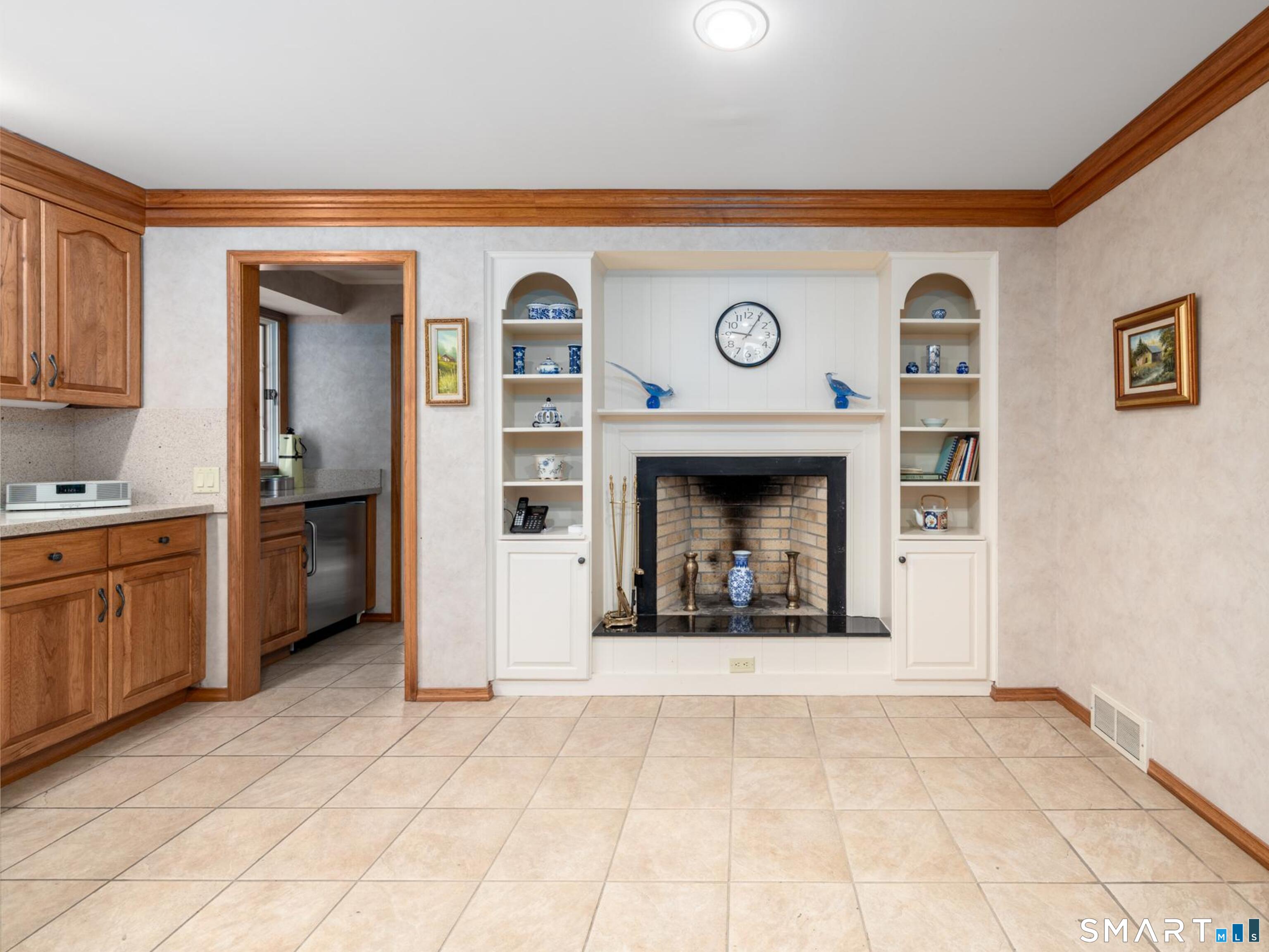 117 Crest Road Middlebury, CT 06762 - Photo 10 of 38 Eat in kitchen or choose some wine from your butlers pantry, add a couple of oversized chairs to enjoy the fire while your waiting for the Sunday roast to be done.