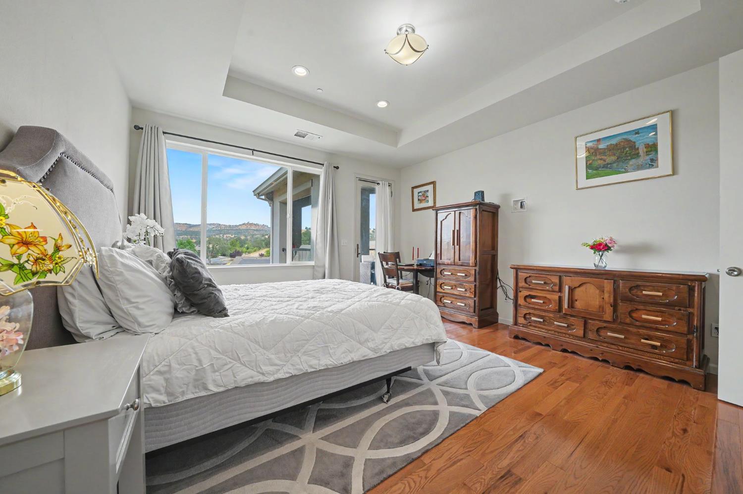 6066 Bluff View Road Copperopolis, CA 95228 - Photo 46 of 96 a bedroom with a bed a dresser and next to a window