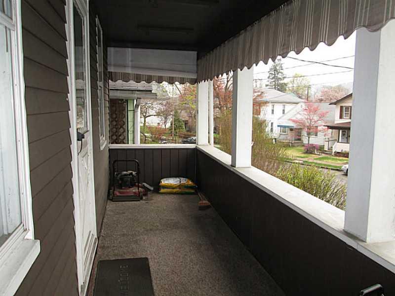 228 Ridge Avenue Kittanning, PA 16201 - Photo 2 of 14 Patio/Deck. 20x6 inviting front porch.