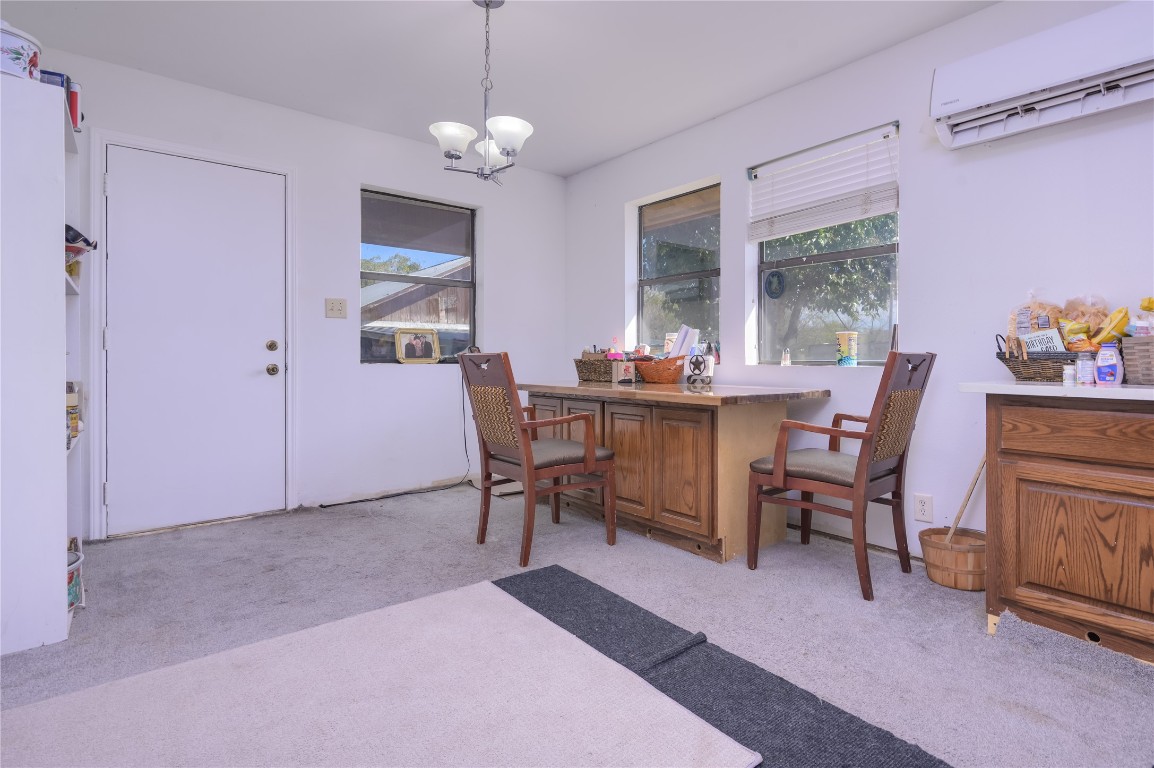 368 Lytton Lane Dale, TX 78616 - Photo 15 of 29 a dining room with furniture a chandelier and a rug