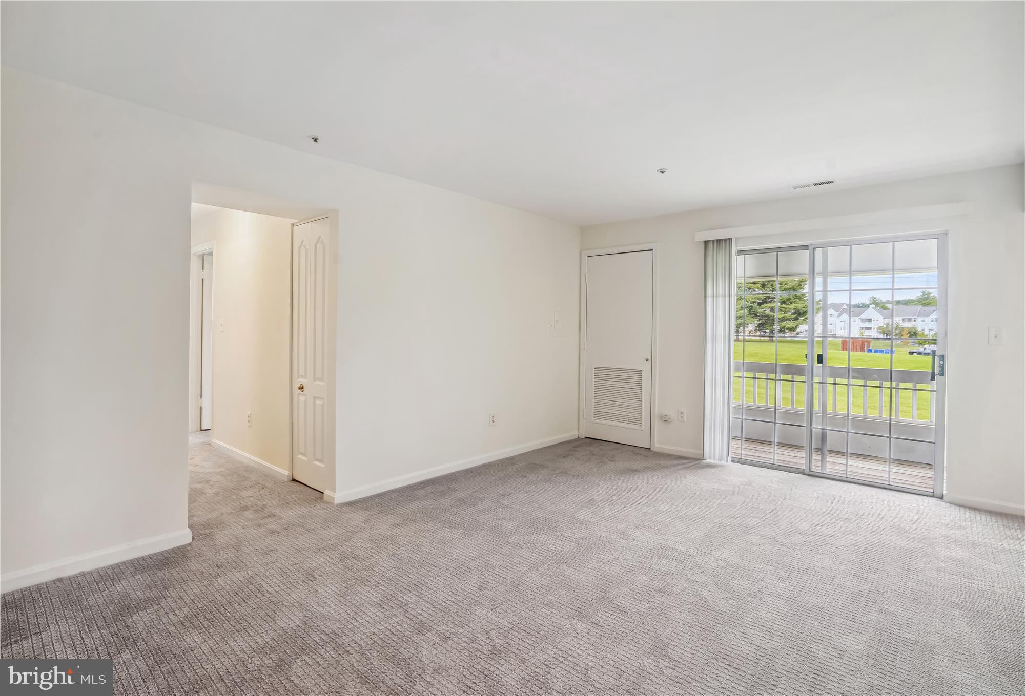 8555 Falls Run Road, Unit F Ellicott City, MD 21043 - Photo 6 of 36 Living Room -Window Walls to Deck