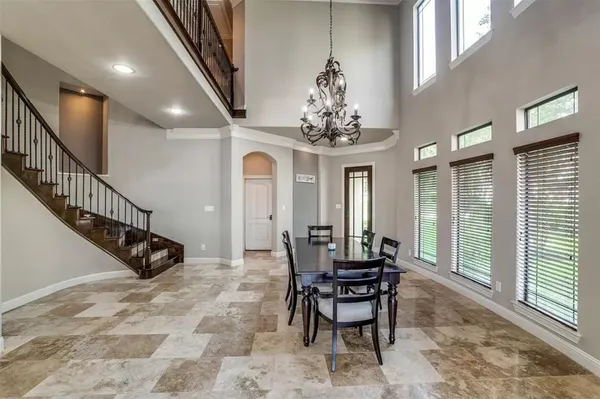 a view of a livingroom with furniture and windows