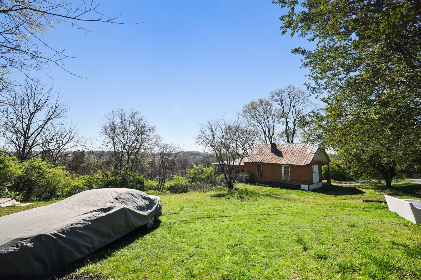5052 Mt View Road Antioch, TN 37013 - Photo 20 of 39 a view of a backyard with a garden and trees