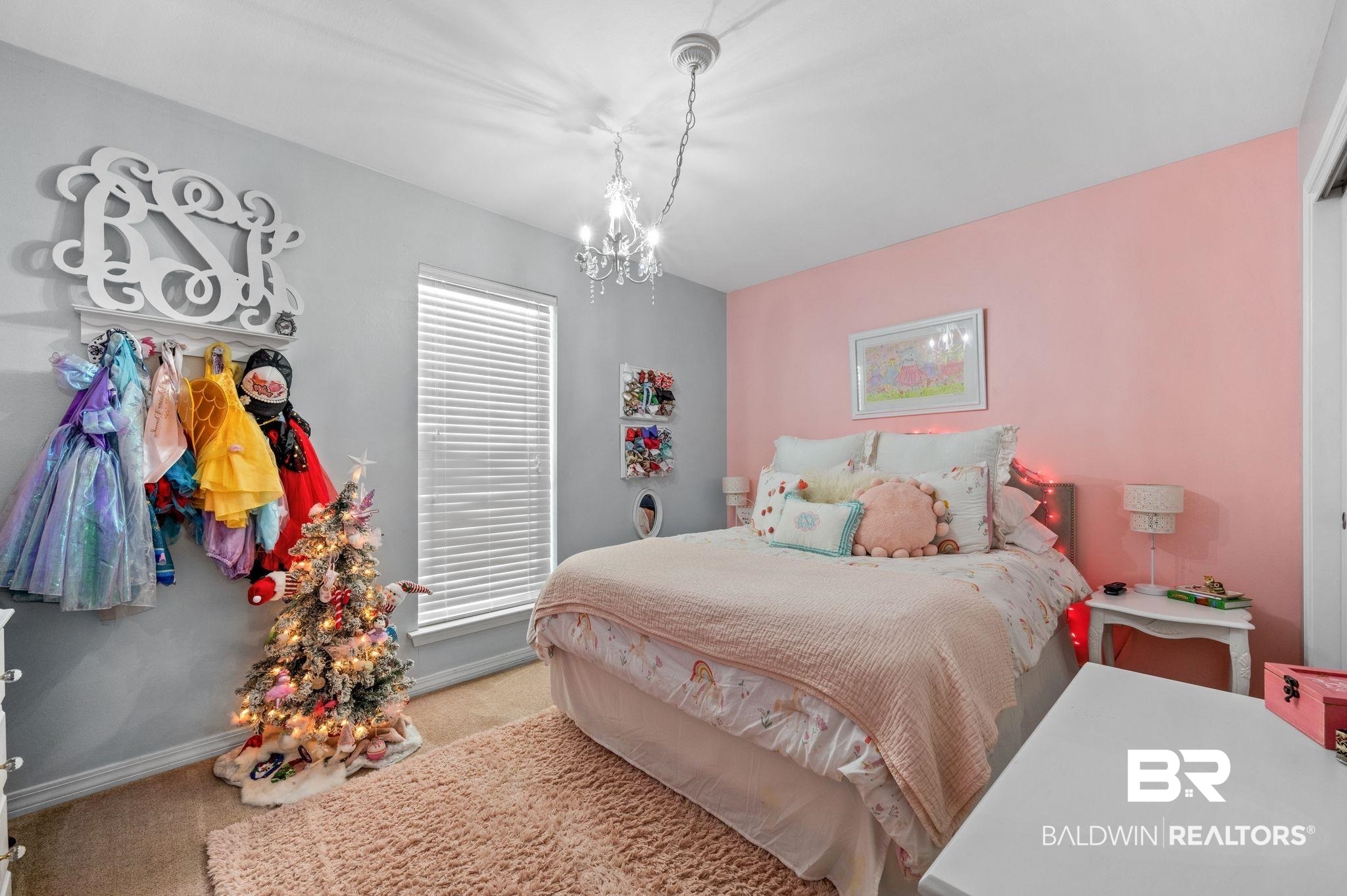 9366 Fox Run Court Semmes, AL 36575 - Photo 18 of 29 Carpeted bedroom featuring multiple windows and an inviting chandelier