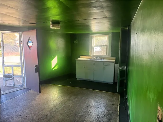 a room with a window and a sink