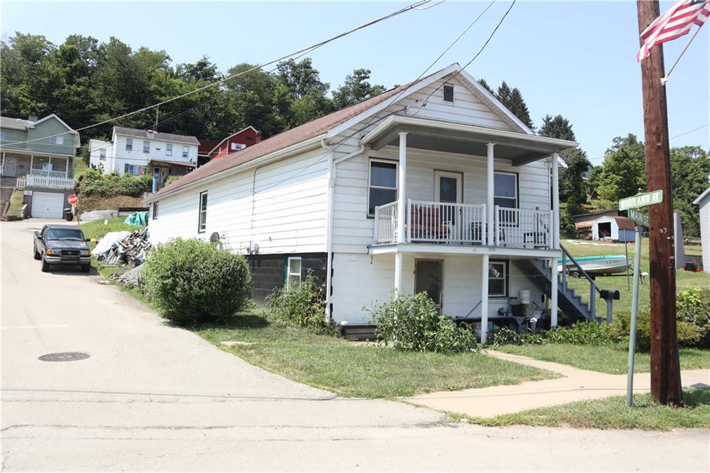 601 Main Street Merrittstown, PA 15463 - Photo 2 of 18 a view of a house with a yard and plants