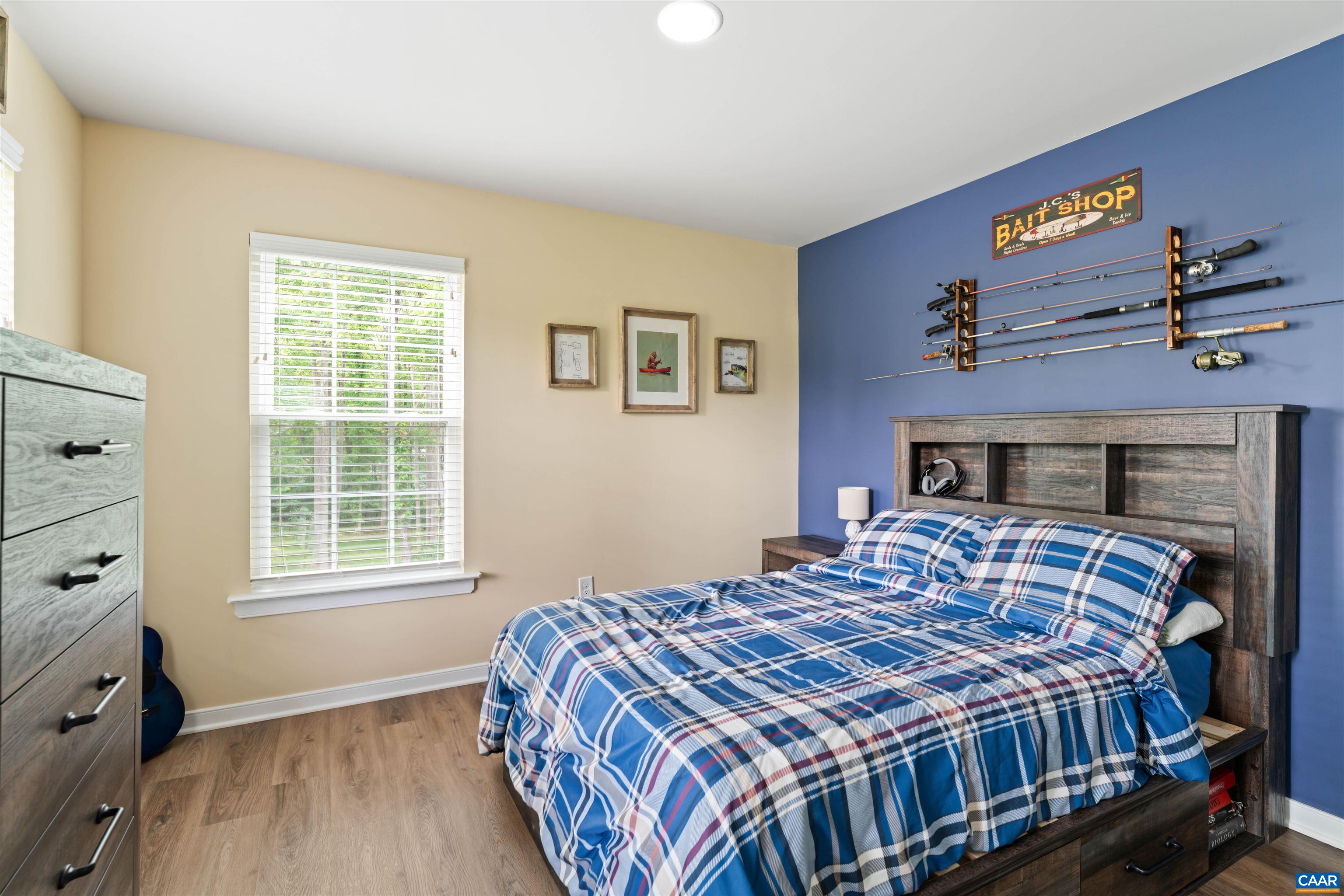 1760 Haden Martin Road Palmyra, VA 22963 - Photo 38 of 51 a bedroom with a bed a dresser and window