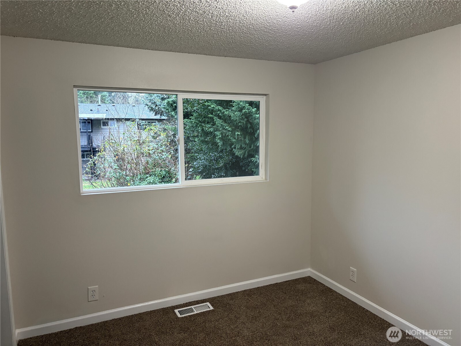 16312 127th Place Southeast Renton, WA 98058 - Photo 12 of 25 an empty room with a window